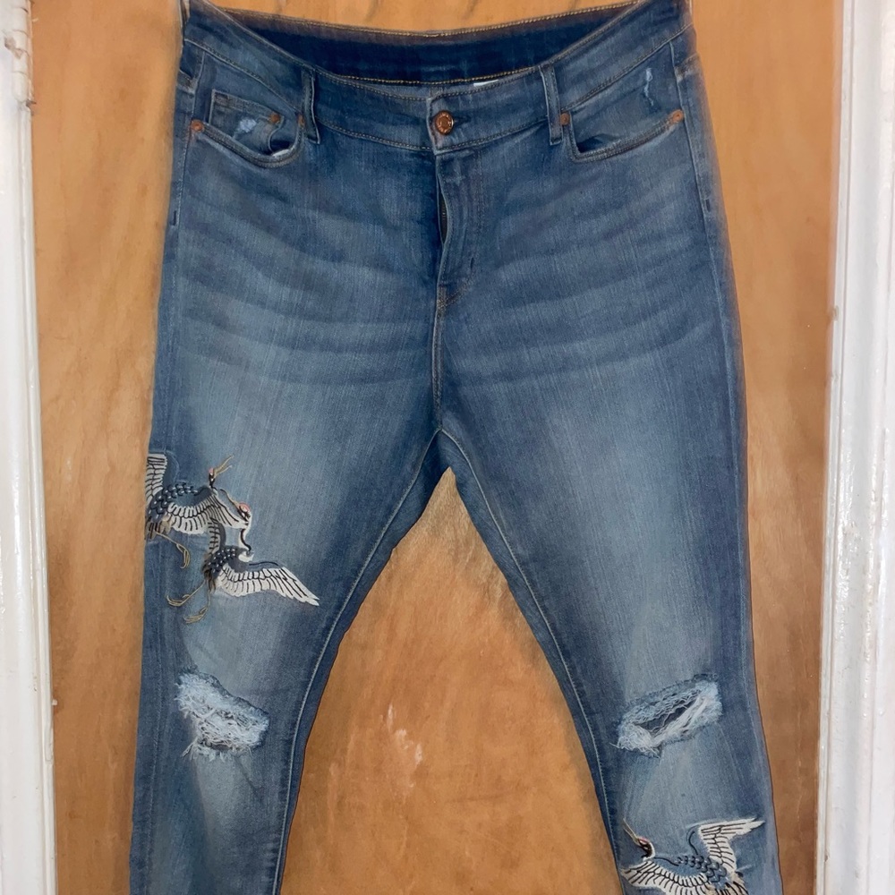 H&M  skinny regular waist jeans light blue with crane details.